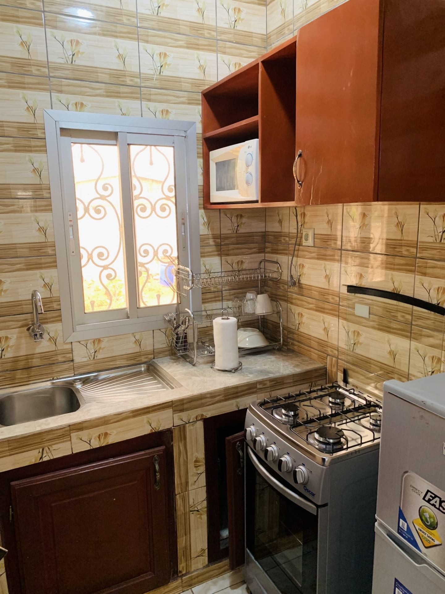 Full private kitchen with 4-burner gas cooker, microwave and fridge
