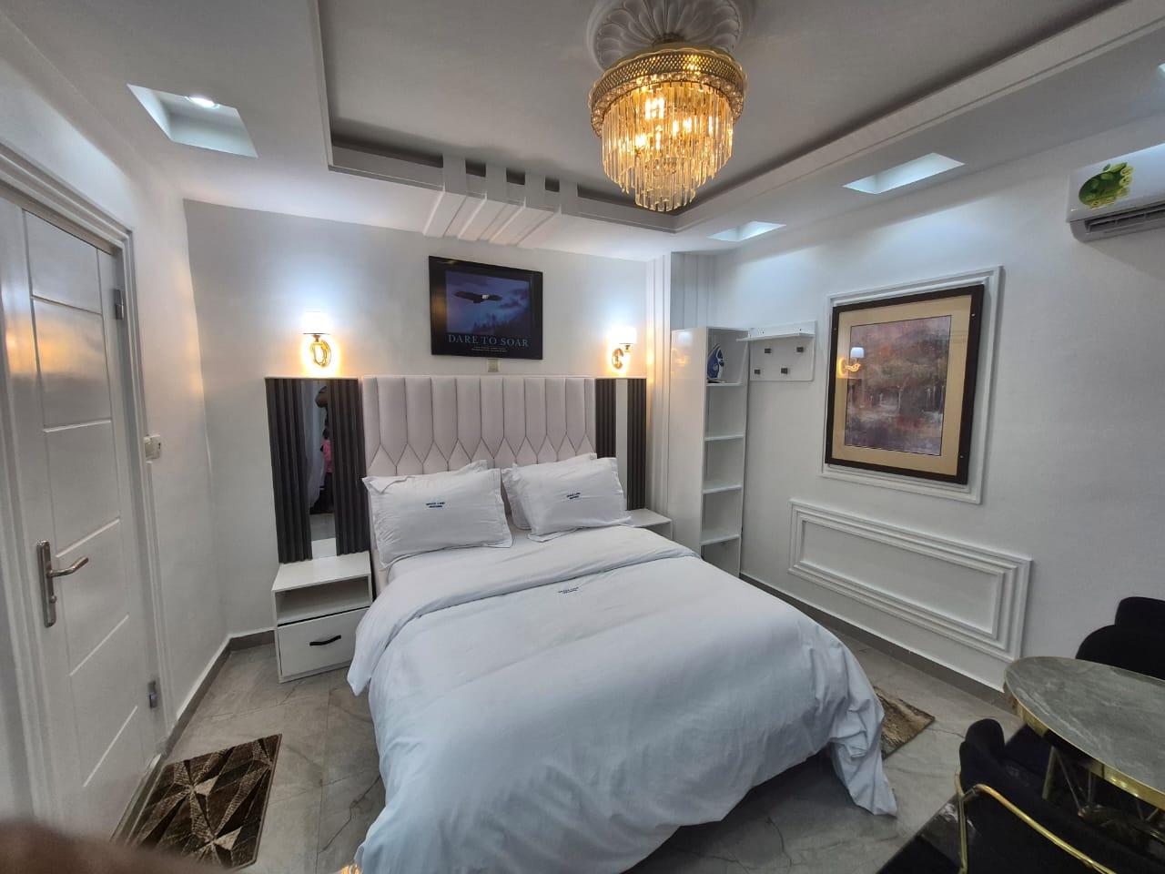 Bedside lighting, mirror and fitted wardrobe